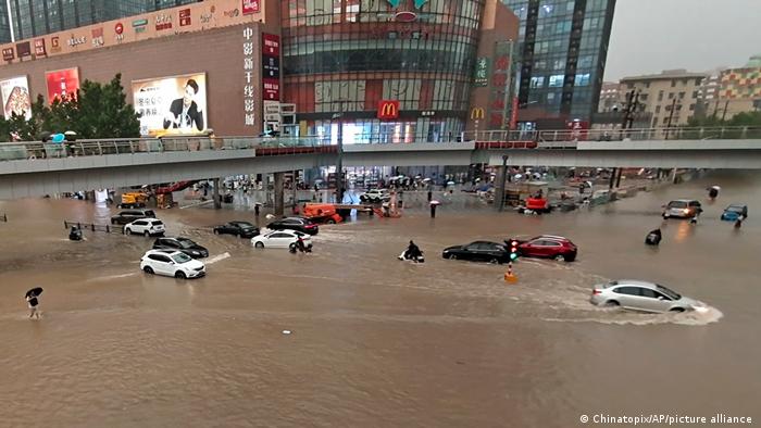 China floods: 12 dead in Zhengzhou train and thousands evacuated in Henan