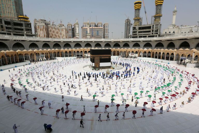 As the first Hajj pilgrims arrive, Saudi Arabia relaxes its mask regulations.